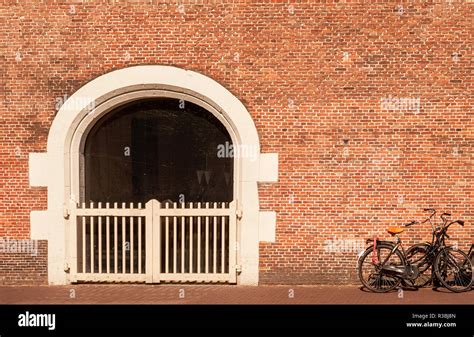 Traditional Dutch Brick Wall And Bicycles In Amsterdam Stock Photo Alamy