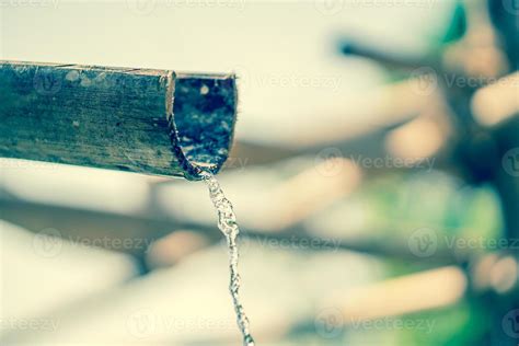 Bamboo fountain with water 22183217 Stock Photo at Vecteezy