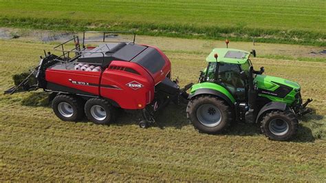 Grass Harvest Mowing Tedding Raking Baling And Wrapping With Kuhn