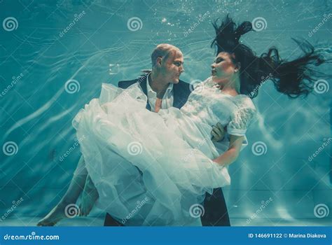 Beautiful Romantic Couple Of Bride And Groom After Wedding Swimming