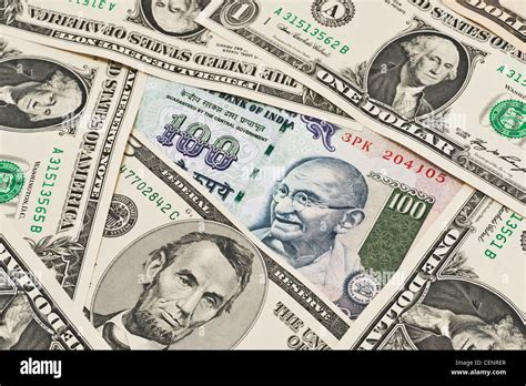 Many U S Dollar Bills Lying Side By Side In The Middle Lies A Indian