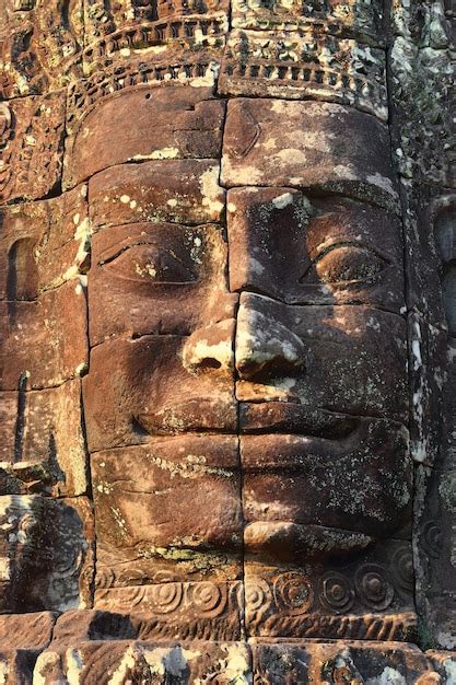 Premium Photo Giant Stone Face At Bayon Temple In Cambodia