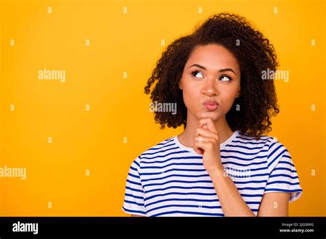 Photo Of Pretty Doubtful Girl Dressed Striped T Shirt Arm Chin Looking