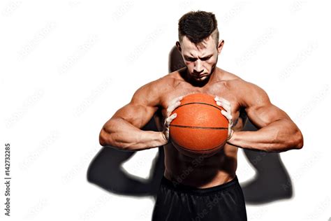 Very Muscular Naked Man Holding A Basketball In Studio Stock Photo Adobe Stock