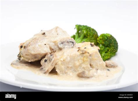 Fish fillet preparation : Served sea bass fillet with mushrooms Stock ...