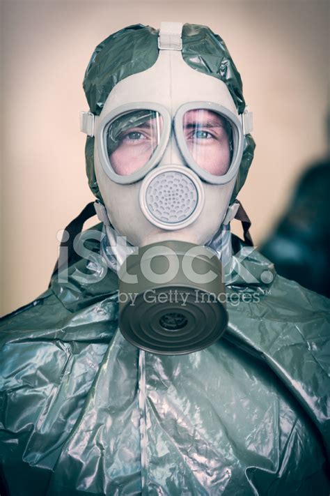 Men Wearing Hazmat Suits And Gas Masks Entering Office Building Stock