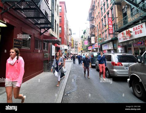 Tourist Walking On Pell Street In Chinatown In Manhattan New York City