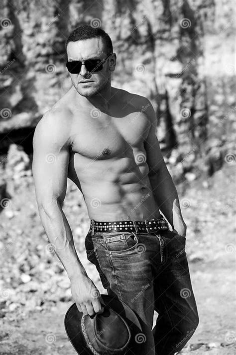 Man Body Outdoor Hunk Handsome Muscular Shirtless Man In Jeans Outdoors Strong Athlete Stock