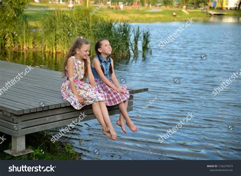 Стоковая фотография 1126274573: Happy Children Little Girls Sit Play
