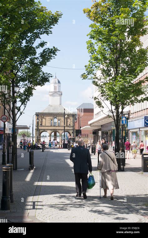 Senior couple walking along King Street, South Shields town centre