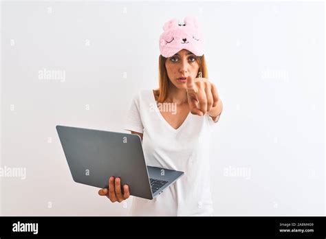 Beautiful Redhead Woman Wearing Sleeping Mask Using Laptop Over