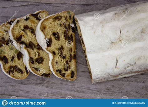 The Three Slices And The Main Part Of Stollen On A Wooden Background