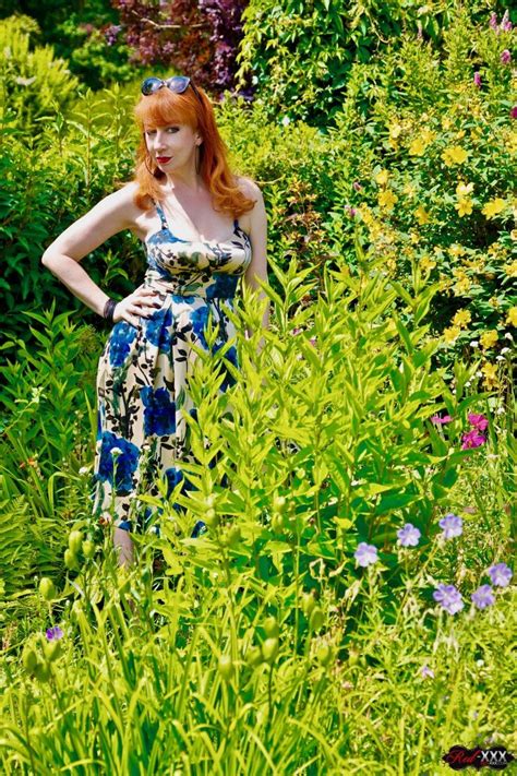 Ginger MILF Red XXX Masturbates In A Courtyard Photos