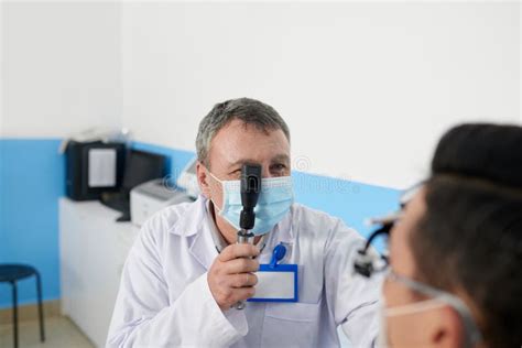 Ophthalmologist Using Retinoscope Tool Stock Photo - Image of ...