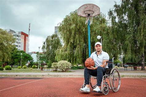 Dad Plays With His Disabled Son On The Sports Ground Concept