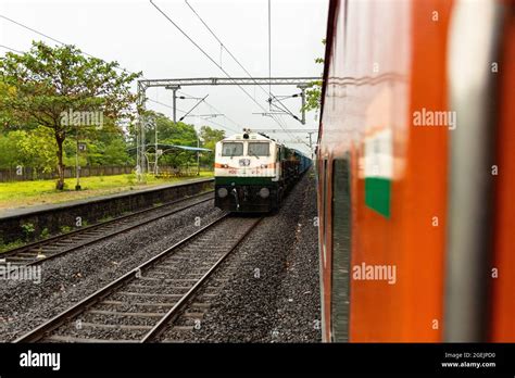 Freight train crossing at Kudal Railway Station during Monsoon season ...