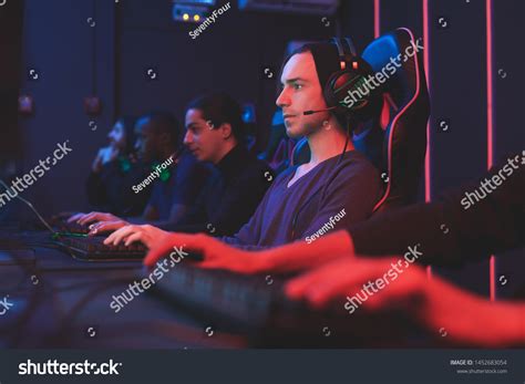 Serious Concentrated Gamers Headphones Online Communication Stock Photo