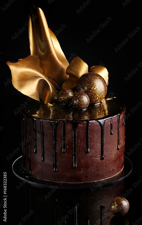 Fancy chocolate cake, isolated, black background Stock Photo | Adobe Stock