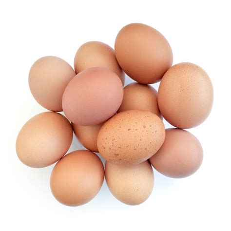 Premium Photo Close Up Of Brown Eggs On White Background