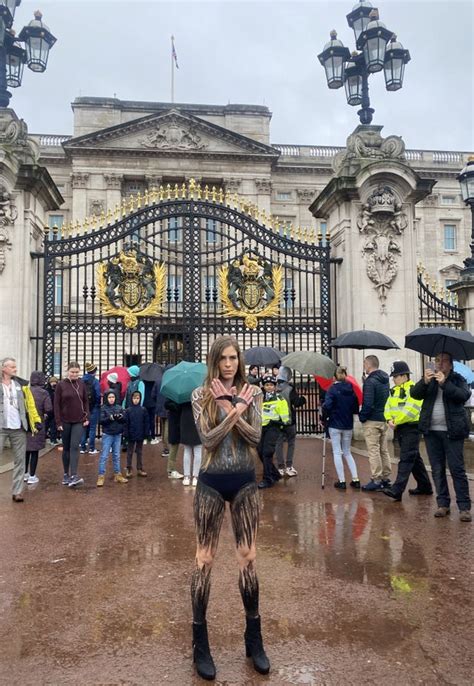 Activist Marches Through London In Almost Nothing But Paint In Bid To