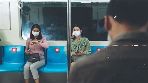 Premium Photo People Wearing Face Masks On A Crowded Public Subway Train