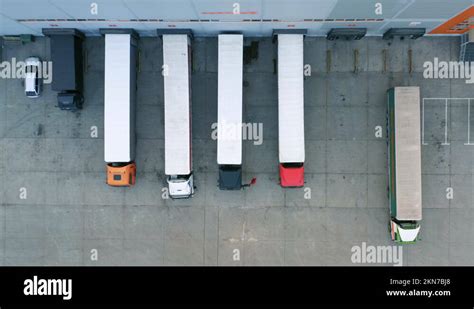 Semi Trailers Trucks Stand At Warehouse Ramps For Loading And Unloading