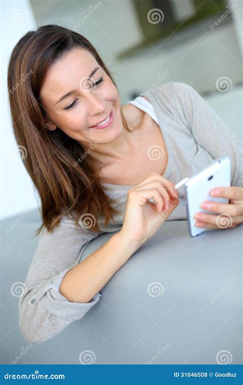 Cheerful Brunette Woman Using Smartphone With A Pen Stock Photo Image Of Internet Pencil