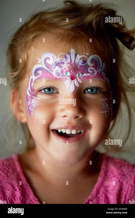 Pretty Exciting Blue Eyed Girl Of 2 Years With A Pink Face Painting