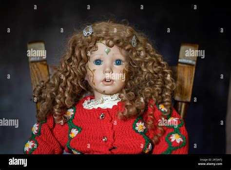 Realistic Porcelain Antique Vintage Girl Doll Or Toy Blonde Curly Hair And Vintage Dress Stock