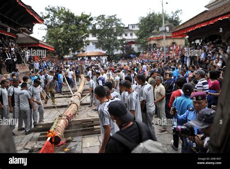 Nepalese Devotees Pulling Rope To Erecting The Long Wooden Log Yo