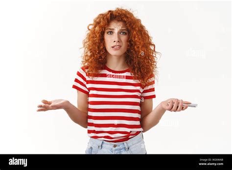 Confused Uncertain Stylish Beautiful Redhead Curly Girlfriend Shrugging