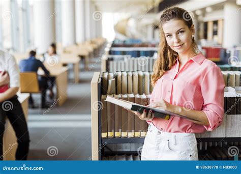 Beautiful Woman Reading A Book In A Library Stock Photo Image Of