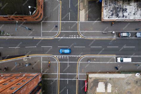 Premium Photo | Aerial view of a crossroad junction in a town in the UK