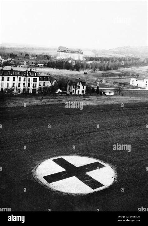 This Red Cross Sign Was Painted On The Ground Near A Large French