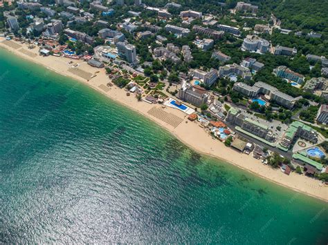 Premium Photo | Aerial view of the beach and hotels in golden sands