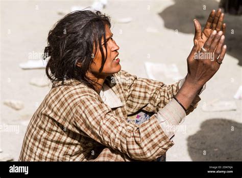 Hemis, India - June 29: homeless beggar women with outstretched arms ...