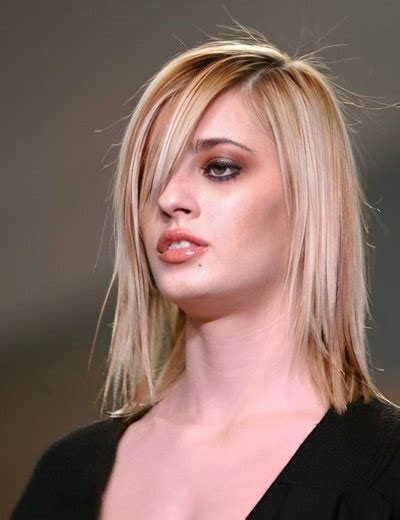 Medium Length Razor Cut Hairstyle With Wispy Ends And Straightness