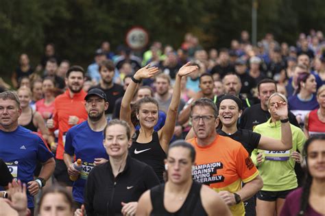 Thousands triumphant as they complete the 2022 Manchester Half ...