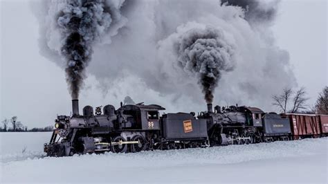 Steam locomotive in the snow - backiee