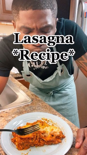 A Man Is Eating Lasagna With A Fork