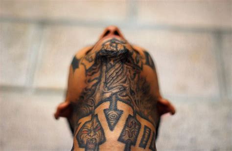 guardian: El Salvador: A member of the Mara 18 street gang poses for a photograph in the Izalco ...