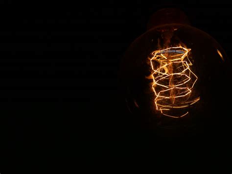 Download Wallpaper 1600x1200 Light Bulb Electricity Spiral Dark