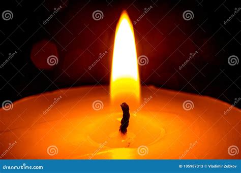 The Flame Of A Burning Candle In The Dark Closeup Stock Image Image