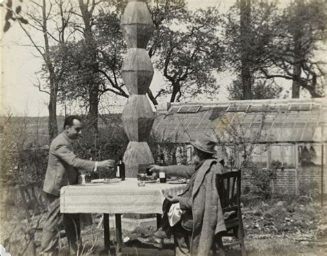 Constantin Brancusi And Man Ray Having A Toast In Front Of Endless