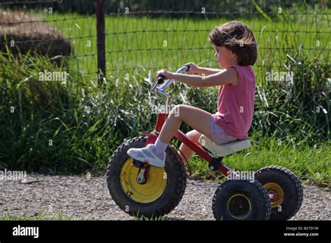 4 6 Years Old Girl Riding A 3 Wheels Bike Stock Photo Royalty Free