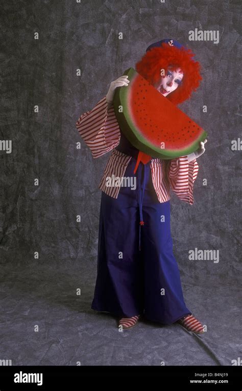 Clown With Watermelon Stock Photo Alamy