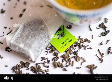 loose green tea leafs  tea bags   cup  green tea isolated