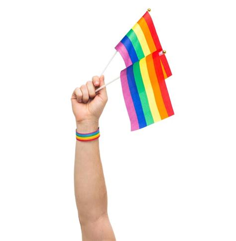 Premium Photo Hand With Gay Pride Rainbow Flags And Wristband
