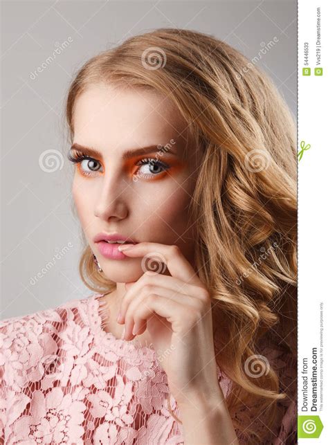 Beauty Studio Portrait Of Girl In Pink Dress With Wavy Hairstyle Stock