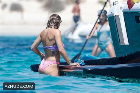 Rita Ora Relaxing On A Boat In Ibiza Spain With Friends In A Purple Bandeau Bikini AZNude